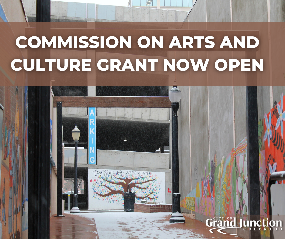 Breezeway leading into a parking garage with snow on the ground. Text on graphic. 