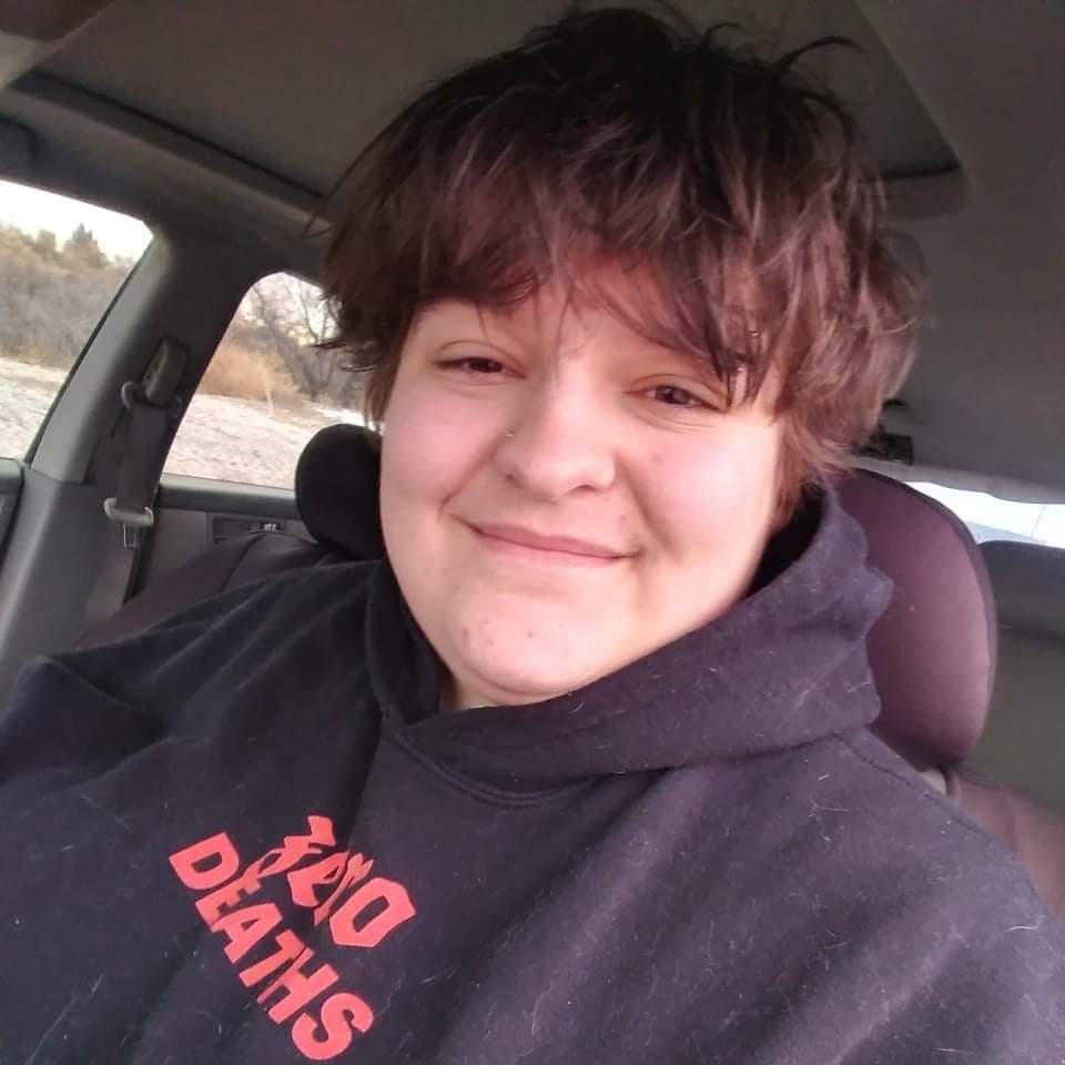 Photo of James Moen seen in a black sweatshirt, with brown hair and brown eyes.