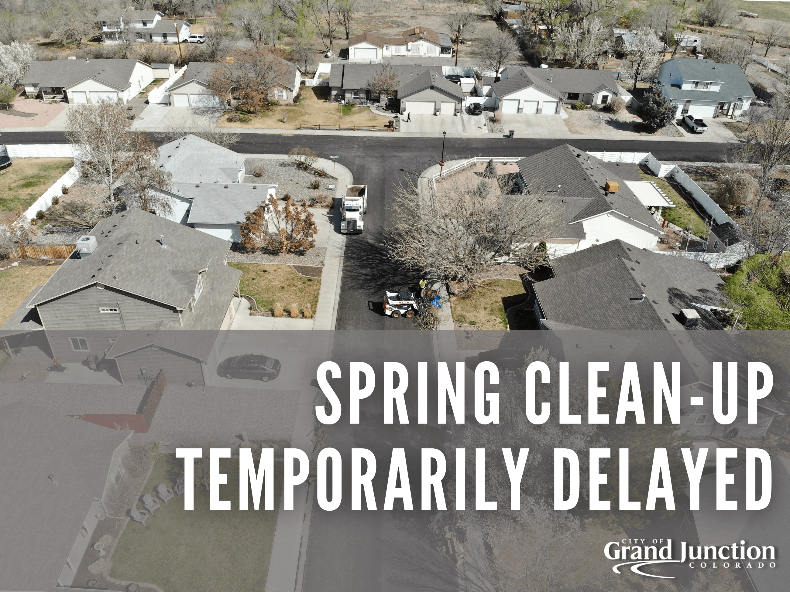 An ariel view of city crews in a neighborhood picking up spring clean up piles. Text on graphic. 