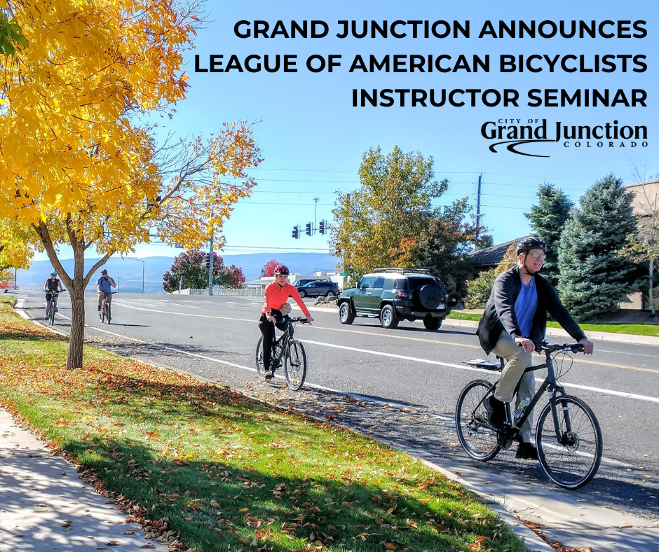A group of cyclists riding on a road. Text on graphic. 