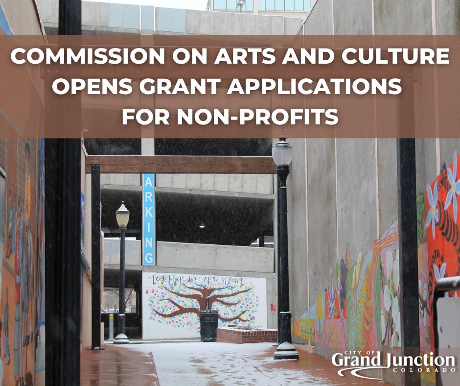 Alley in downtown Grand Junction with flowers painted along the walls.