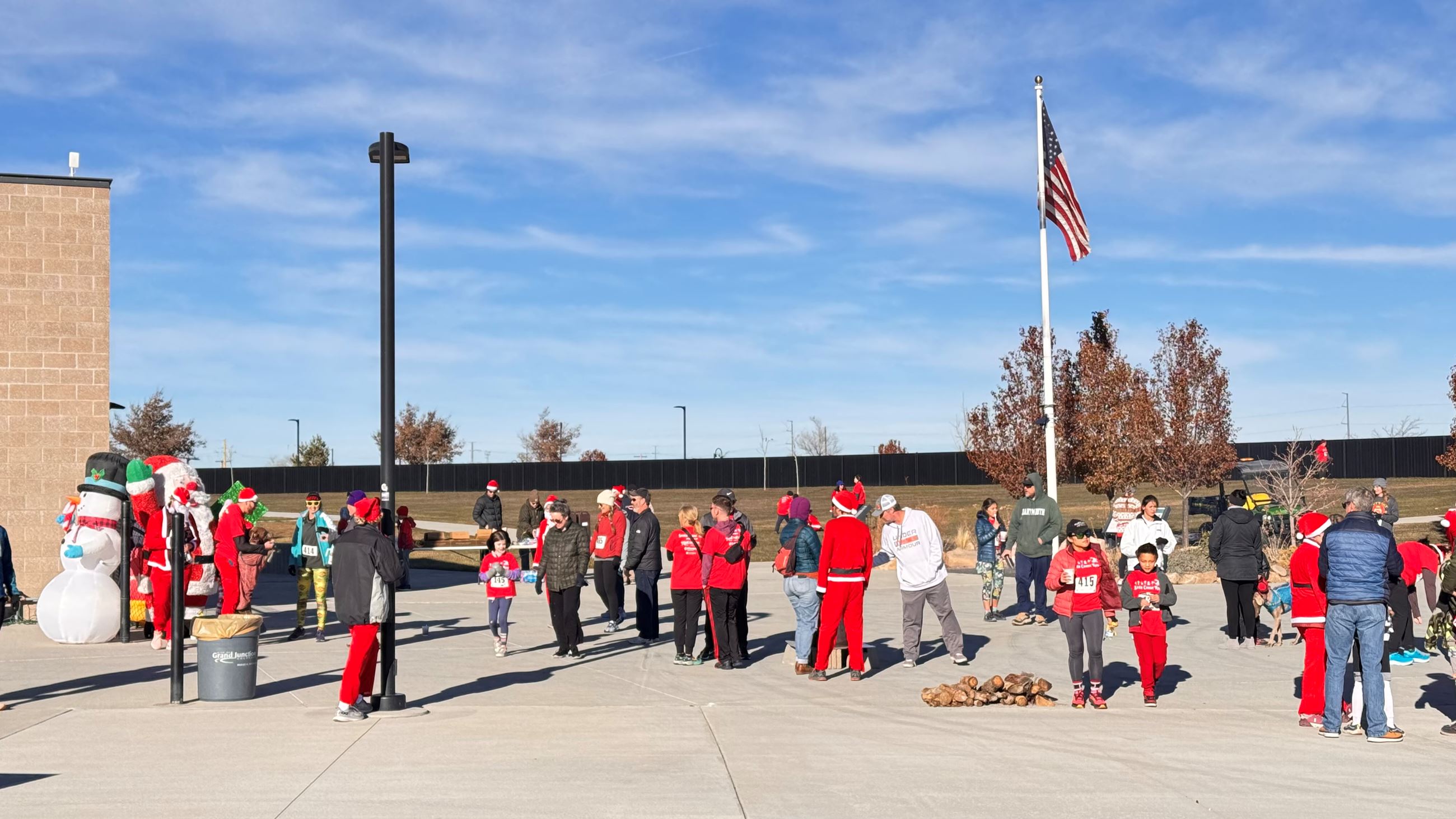 People gathering in groups at the Santa Cause Run.