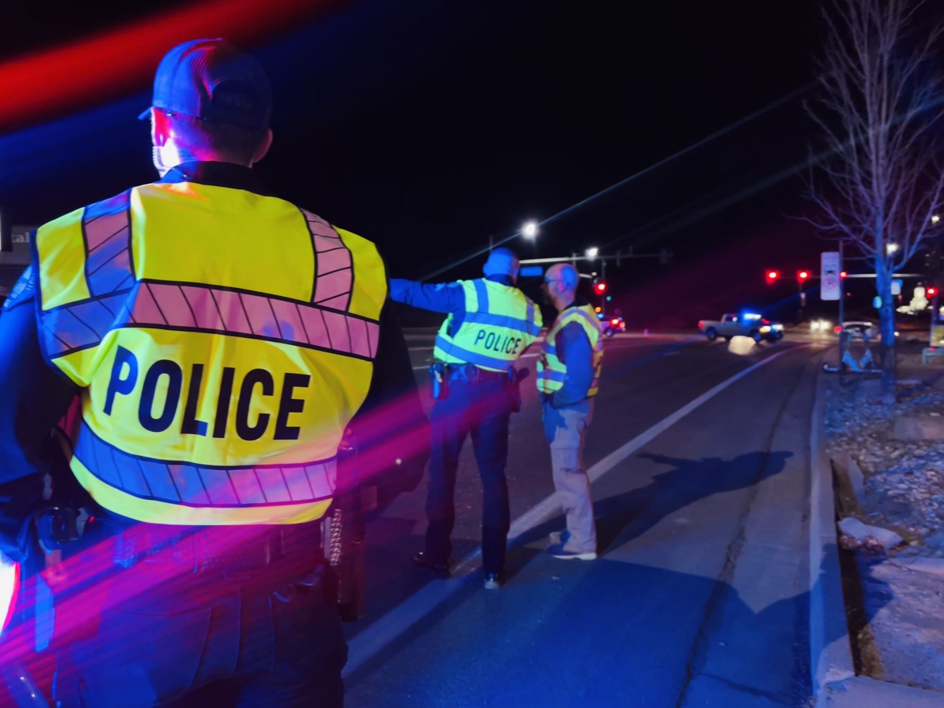 GJPD officers with yellow traffic vests on at scene of a crash