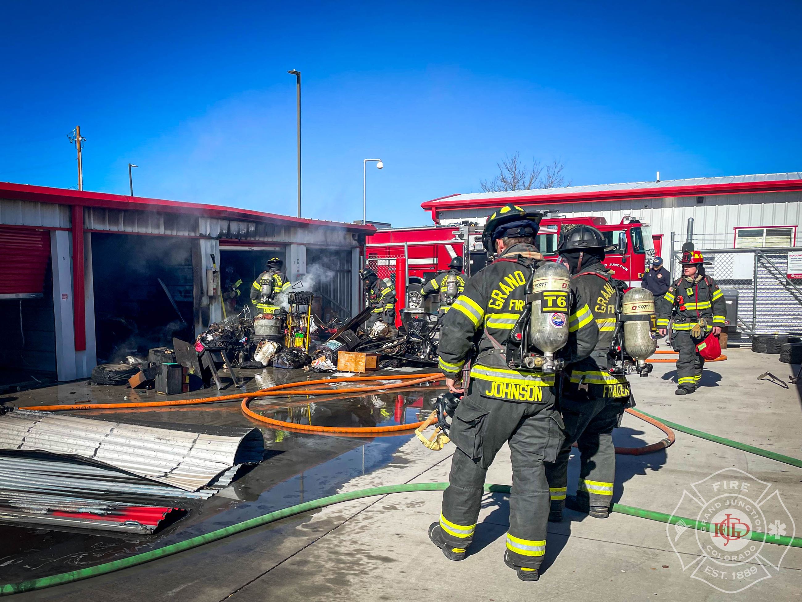 GJFD firefighters extinguish a fire at a storage facility on Riverside Parkway.