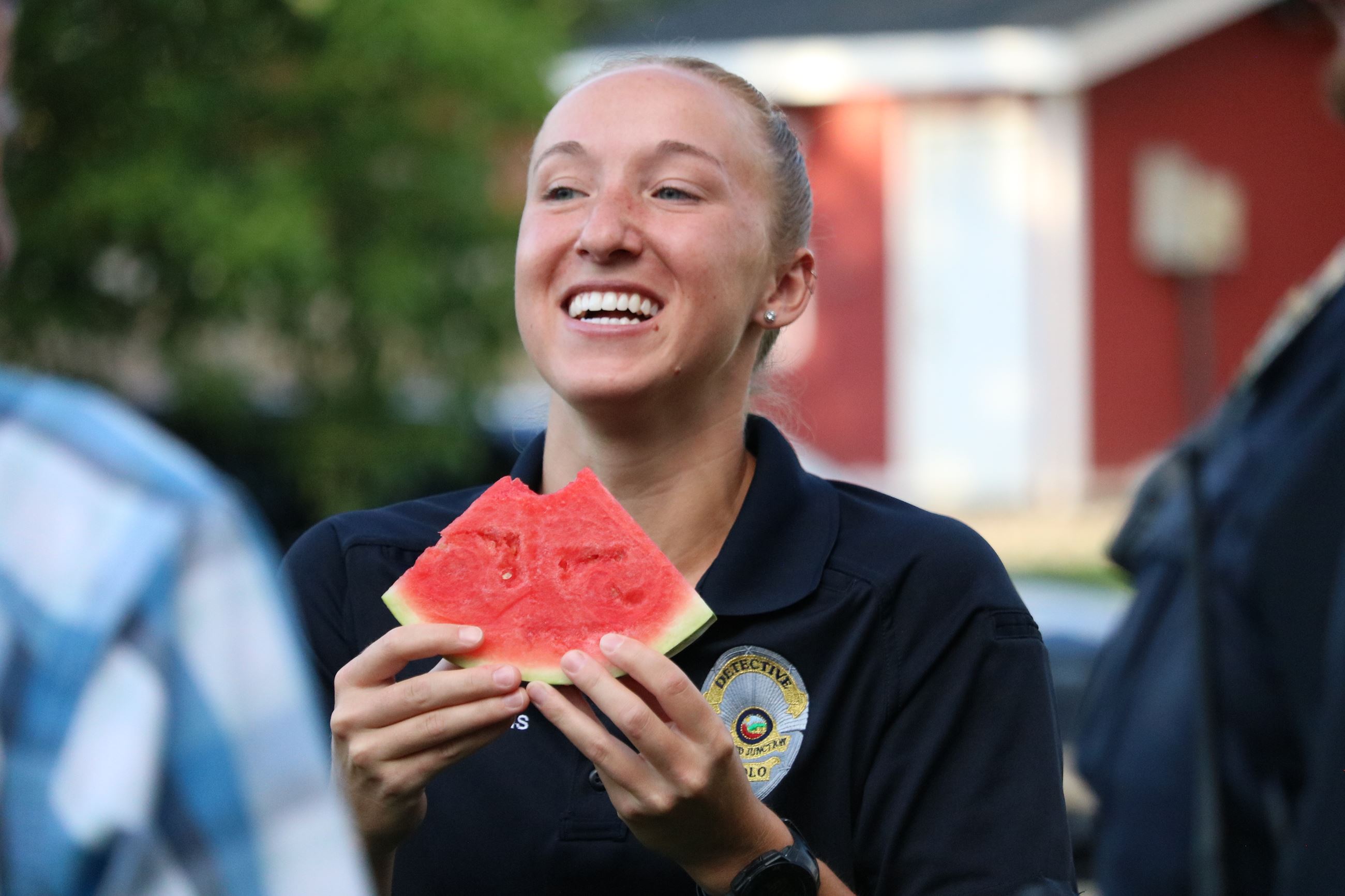 officer smiling with watermelon