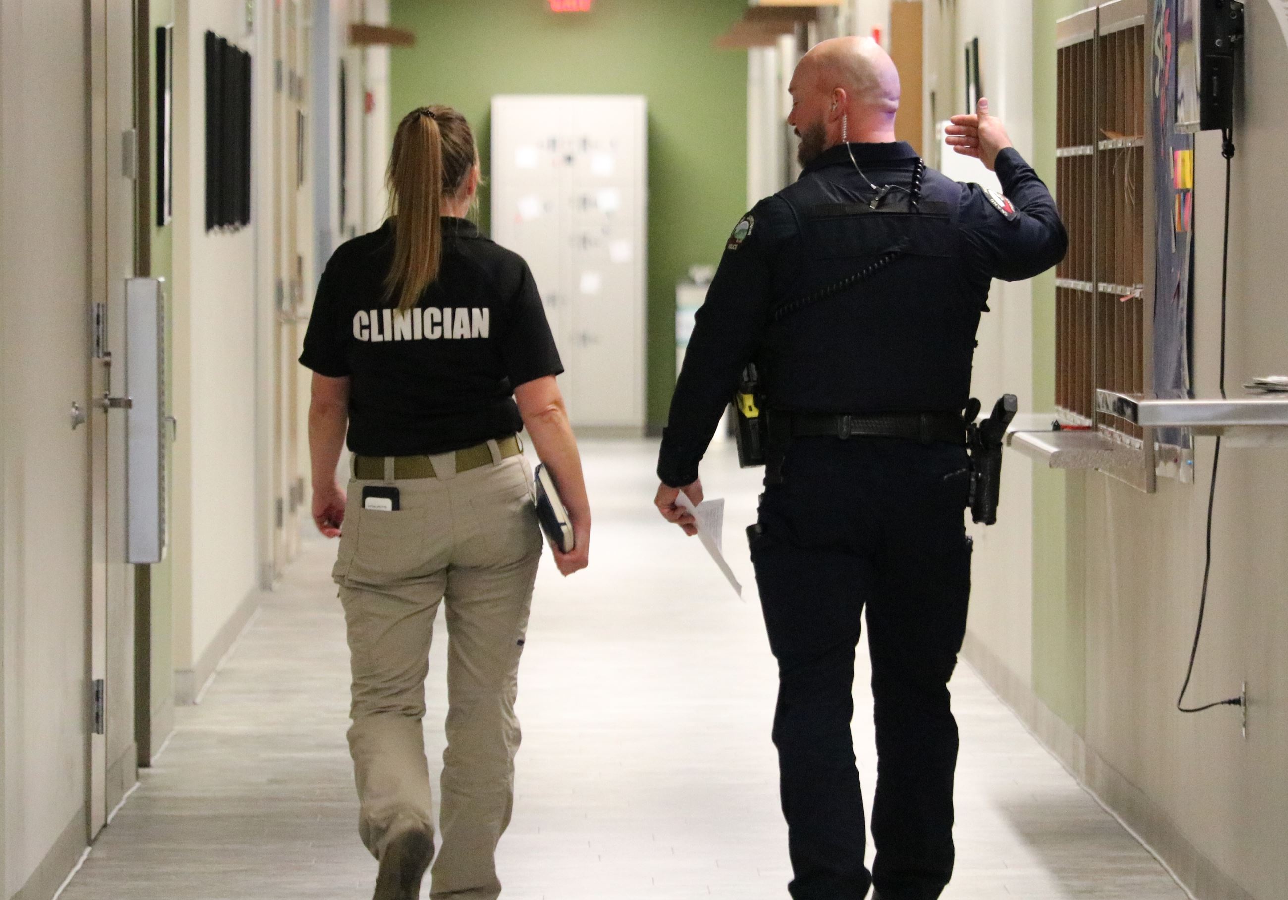 GJPD clinician and officer walking away from the camera