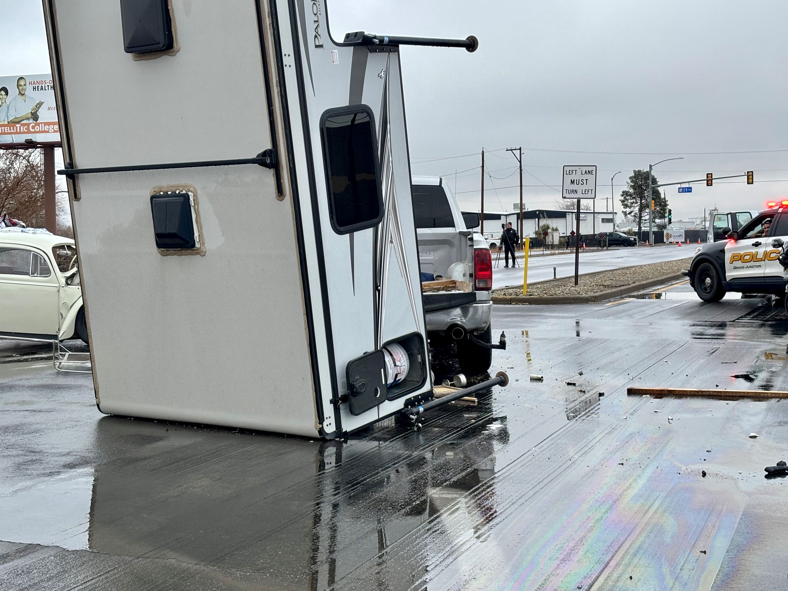 A GJPD patrol car on the scene of a two-vehicle crash