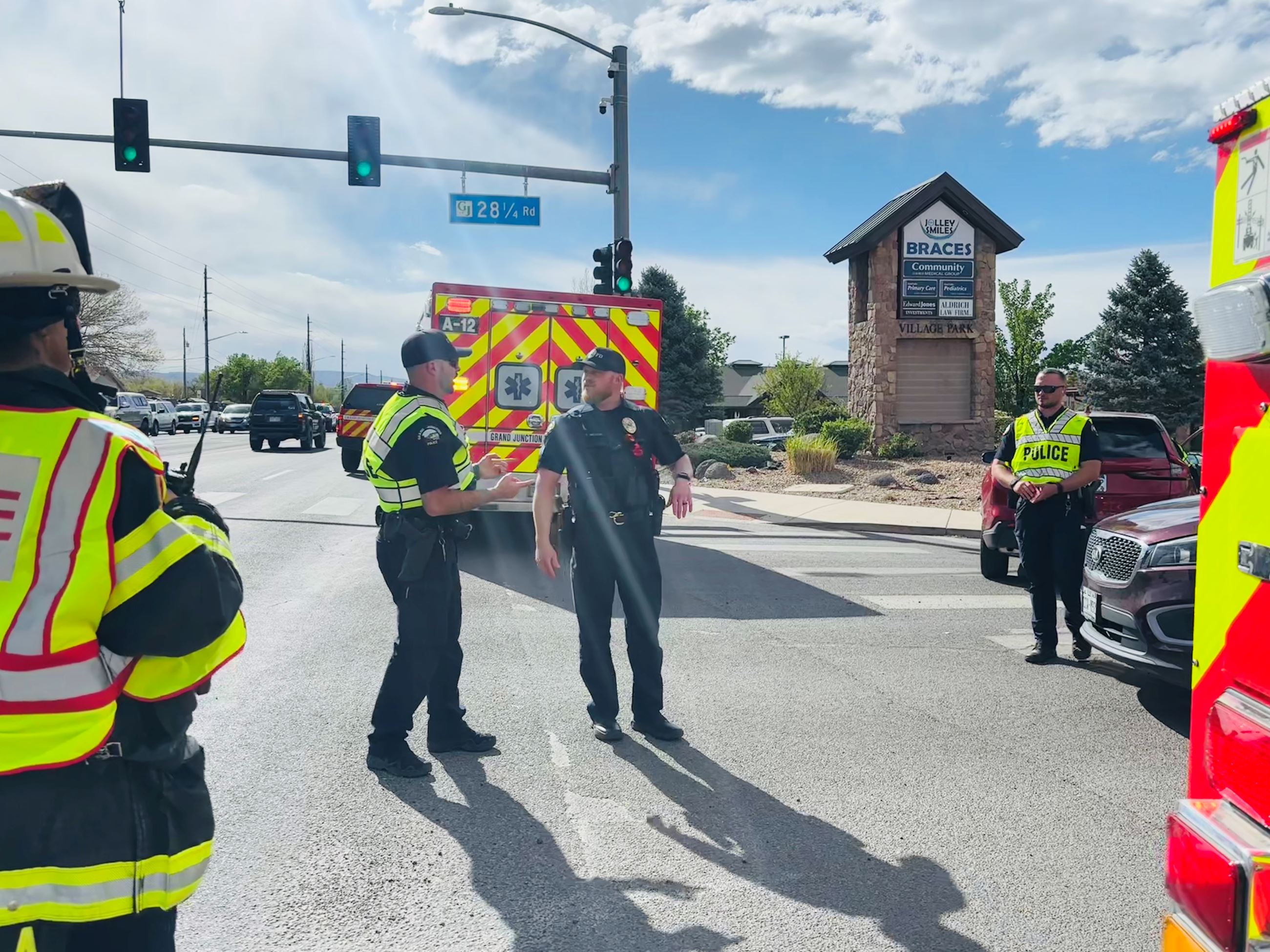Officers and firefighter on scene of crash