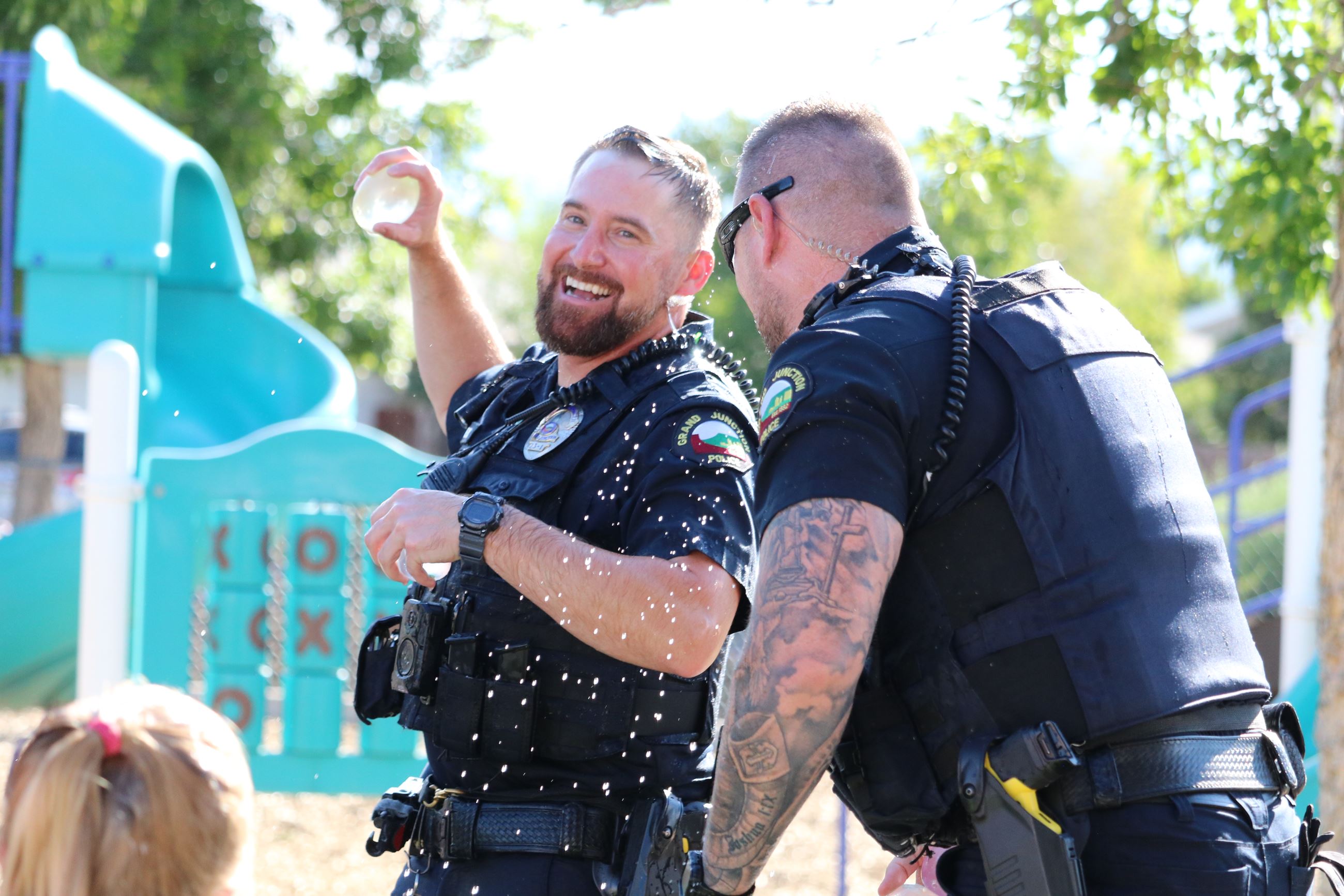 Two officers in water balloon fight