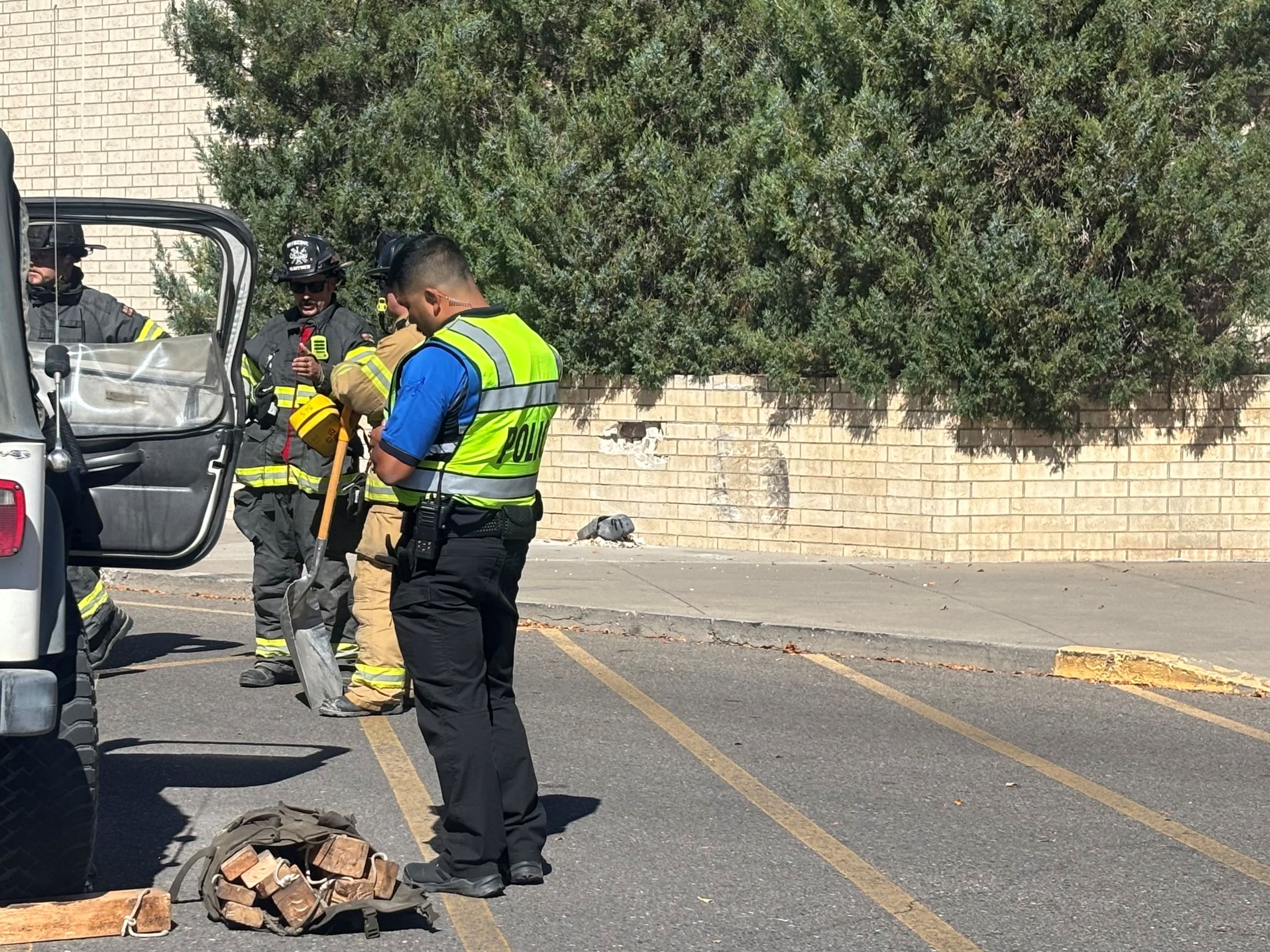 GJPD and GJFD personnel investigating crash into building