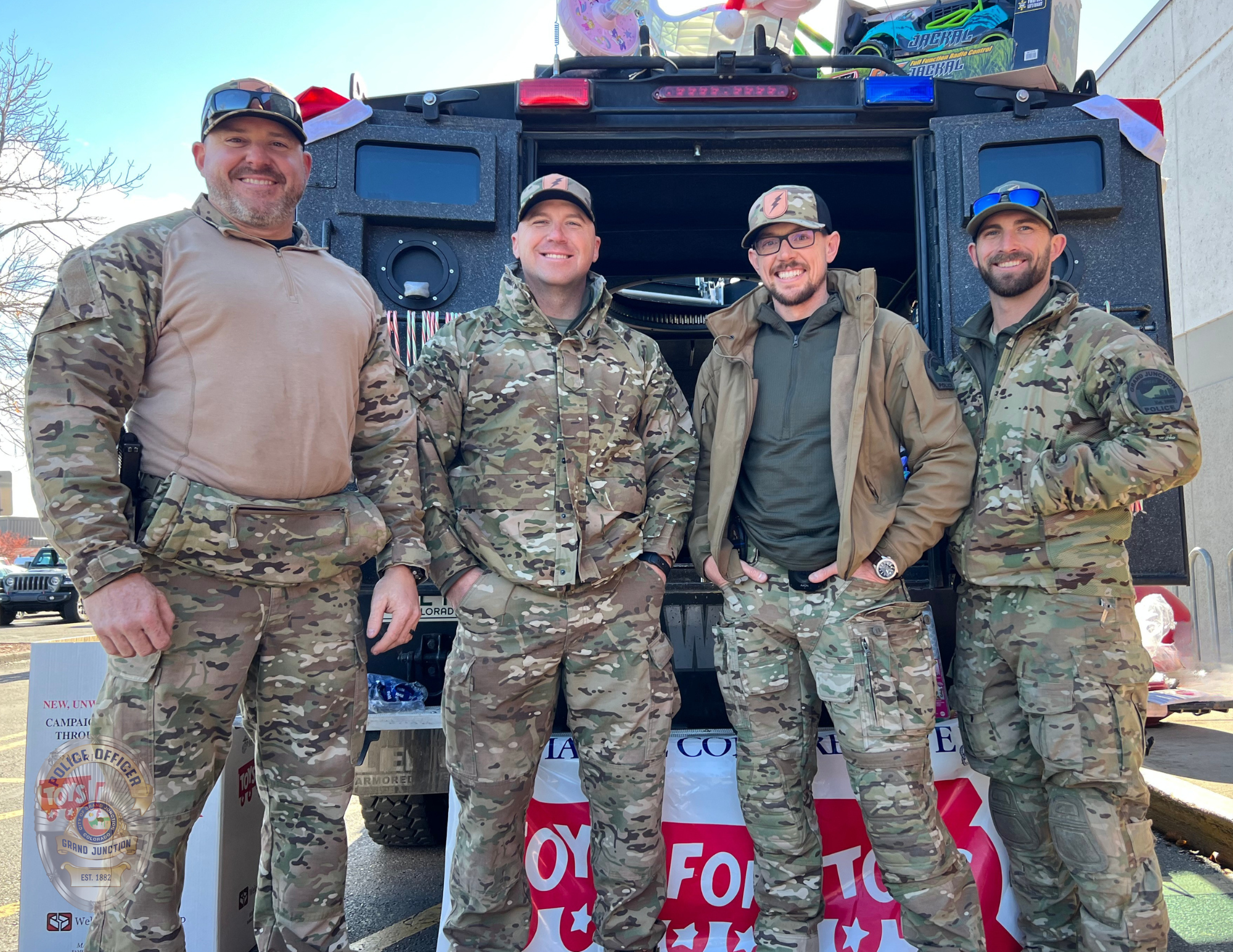 Four SWAT members collecting toys for Toys for Tots